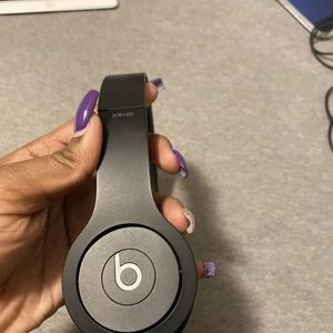 Black beats by dre on ear headphones